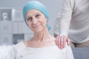 Sick older woman with cancer with inner strength to fight with disease