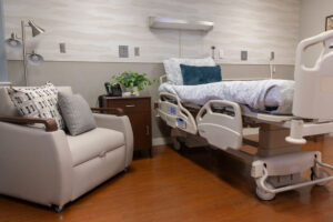 Samaritan Center Mount Holly patient bedroom with comfortable chair for loved ones 