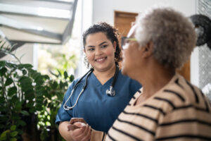 Professional Caregiver looking at patient